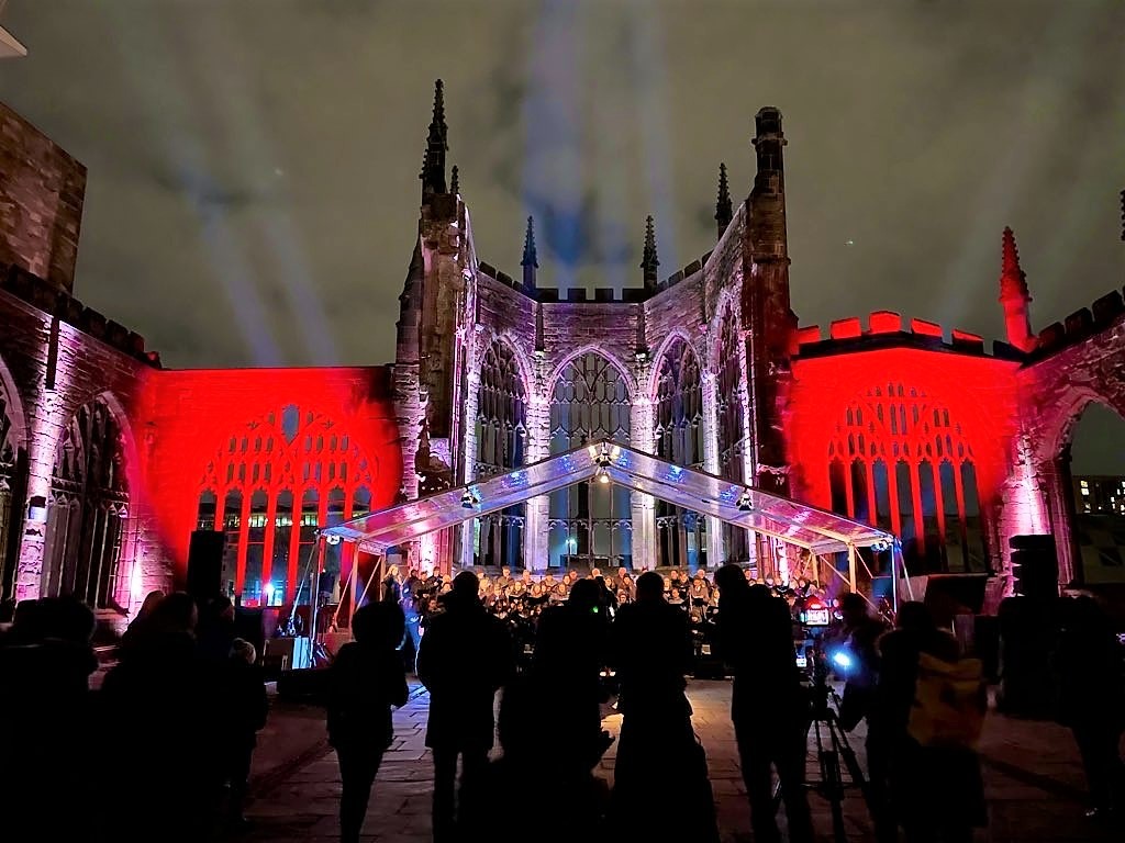 Coventry Cathedral at night with red lights as part of the Ghost in the ruins event
