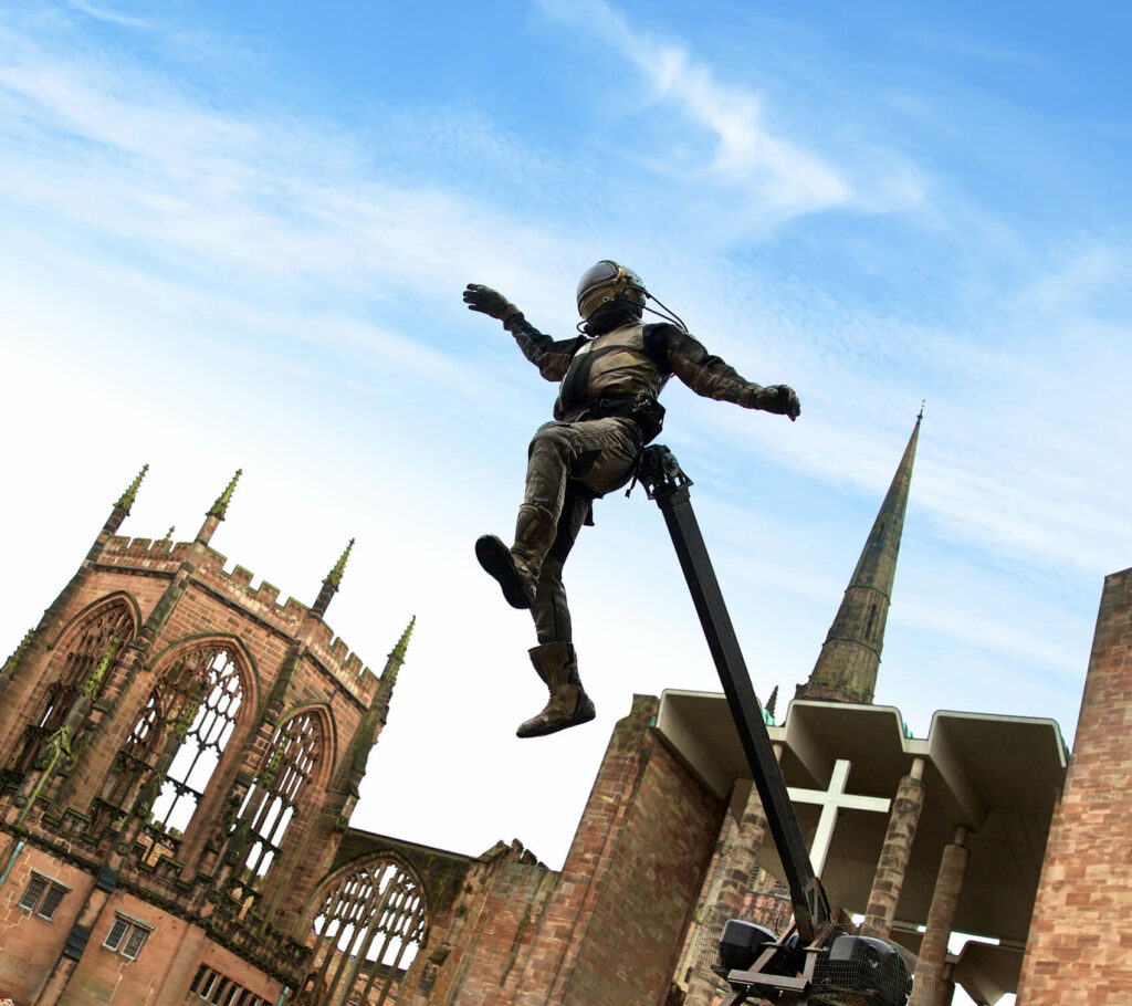 A performer dressed as an aerial astronaut at Coventry Cathedral