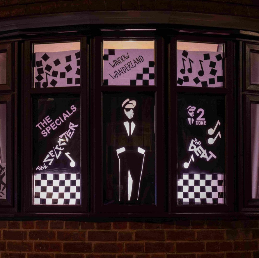 Two toned themed house windows decorated for Window Wanderland